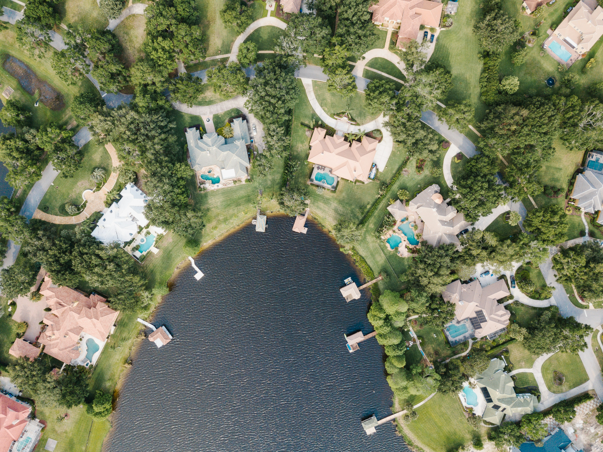 Sky shot of houses on a lake